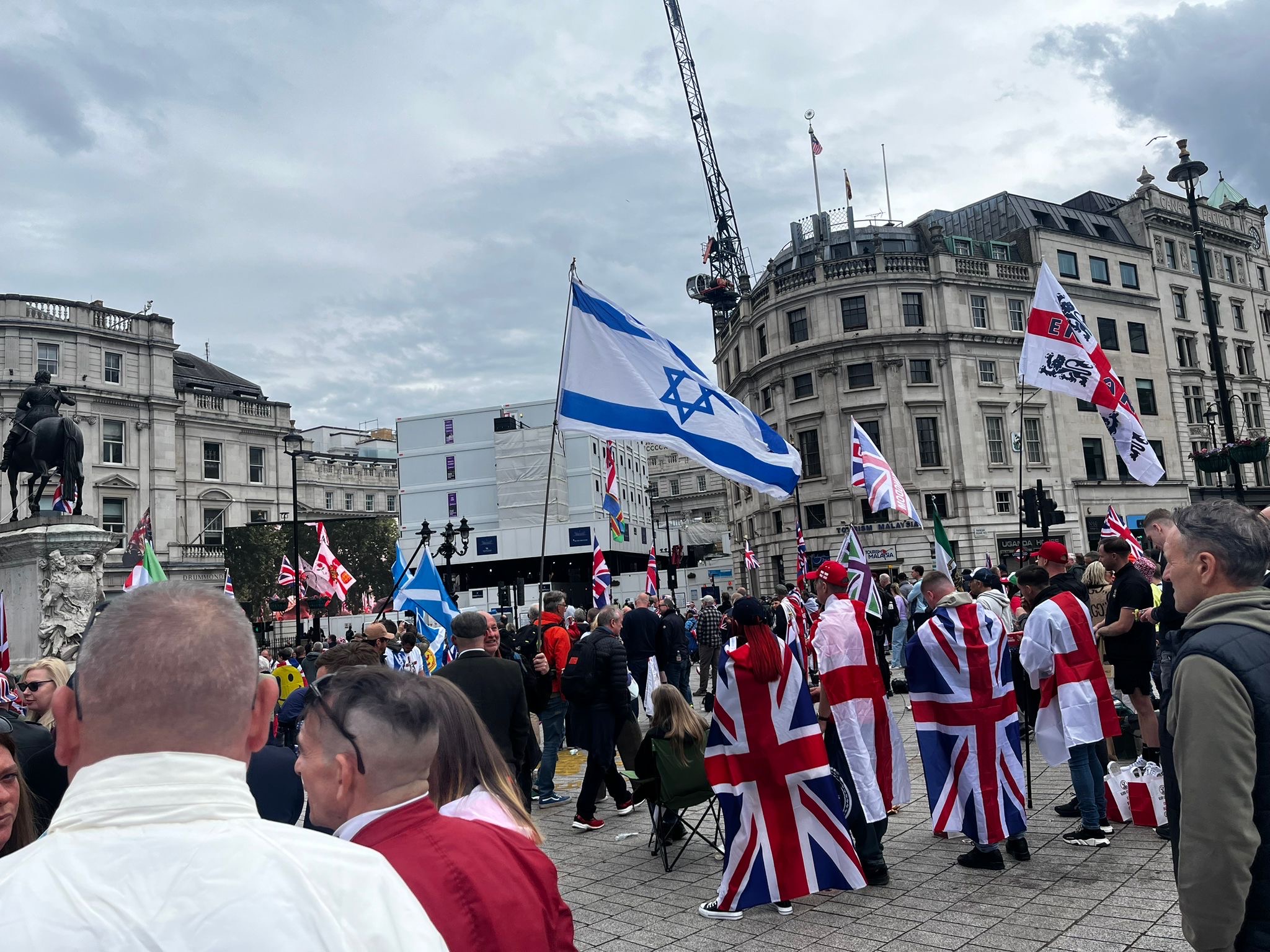 UTK supporters in London carry many flags including Israel flag